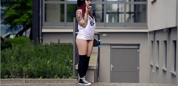  Brunette girl with skateboard flashing in public